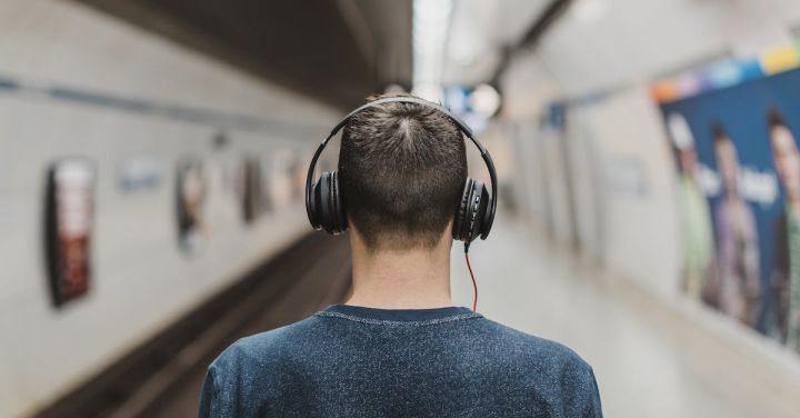 Train Music - Man Wearing Black Headphones Beside Train Rail