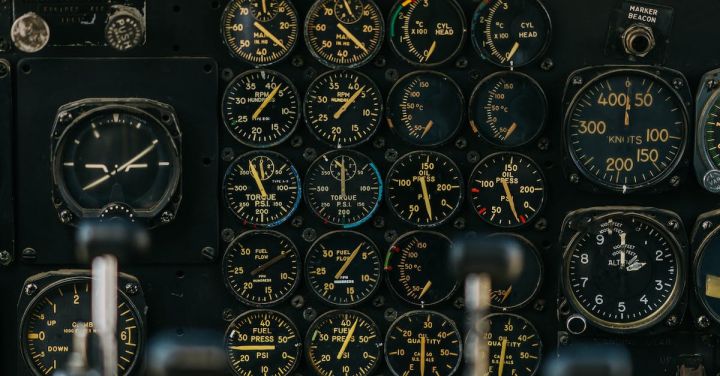 Automatic Train Control - Modern military airplane flight deck with blurred dashboard against panel with gauges