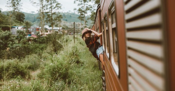 Model Railway - Confident woman in train cabin door