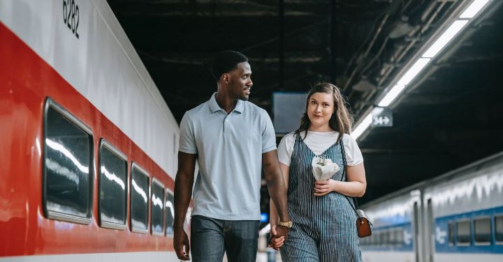 Maglev Trains - Beautiful Couple Walking Near Trains