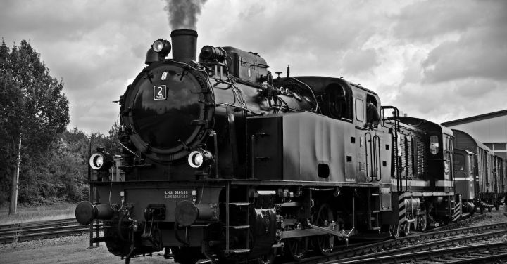 Steam Trains - Train on Railroad Tracks Against Sky