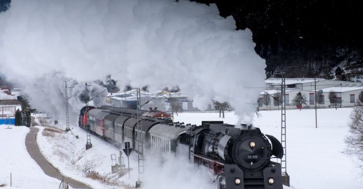 Steam Locomotives - Train Traveling on Snow